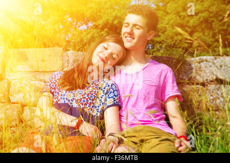 Young happy couple dreaming in the sun Stock Photo