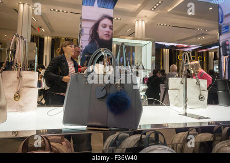 Handbags on display at the Michael Kors boutique within Macy's in