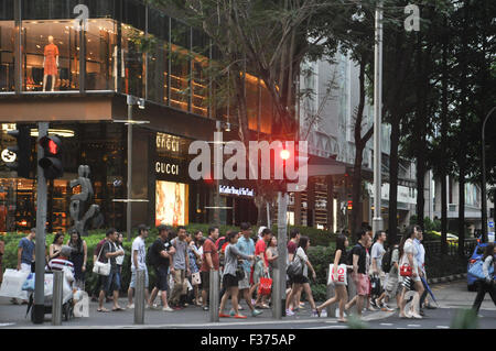 People cross the road at Orchard Road , Singapore. Stock Photo