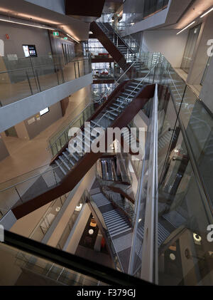 Looking down in atrium showing angled stairs and multiple levels. Faculty of Engineering + Information Technology, University of Stock Photo