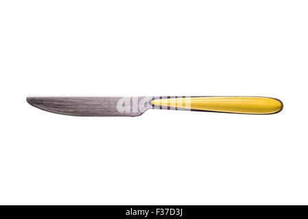A metallic stainless inox table knife with a yellow handle isolated on white background Stock Photo