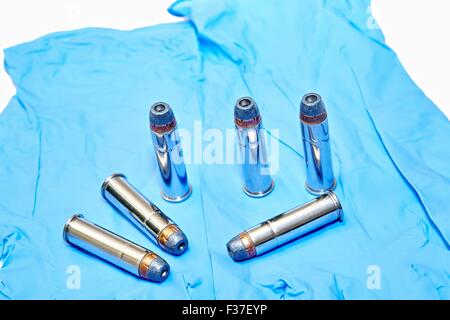 6x 357 Magnum Pistol Cartridges on Latex Gloves Stock Photo