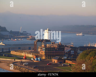 Newcastle Upon Tyne, UK, 1st October, 2015. UK Weather: A fog bank forming and greeping towards Cliffords Fort (1672) and the victorian lighthouse upon the banks of the river Tyne. Credit:  james walsh/Alamy Live News Stock Photo