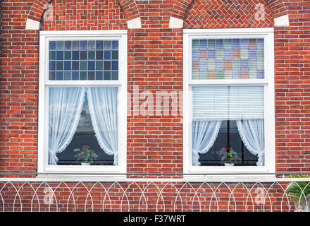 Windows on the brick wall. Stock Photo