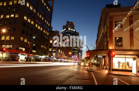 AUCKLAND,  NZL - SEP 29 2015:Traffic on Customs Street in Auckland Downtown at night.Auckland is the country's most cosmopolitan city with the best nightlife in New Zealand.