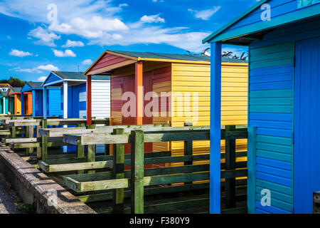 Colourful wooden beach huts in the Kentish coastal resort of Whitstable. Stock Photo