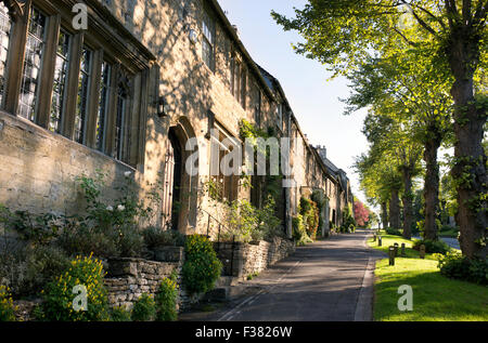 Burford high street houses in evening sunlight. Cotswolds, Oxfordshire, England Stock Photo