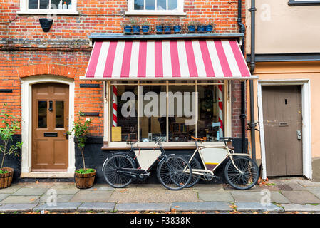 A traditional barber shop with bicycles outside Stock Photo