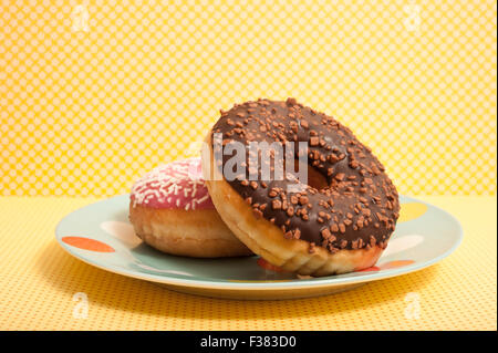 glazed doughnuts on a plate Stock Photo