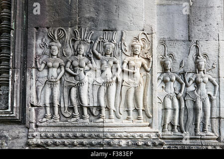 Bas-relief of dancing apsaras (celestial dancers) in Angkor Wat temple. Angkor Archaeological Park, Siem Reap Province, Cambodia. Stock Photo