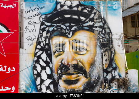 Beirut Lebanon, 1st October 2015. A large fresco painting of former PLO and Palestinian leader Yasser Arafat outside a Palestinian refugee camp in Beirut after the flag of Palestine was flown over the United Nations building in New York for the first time Credit:  amer ghazzal/Alamy Live News Stock Photo