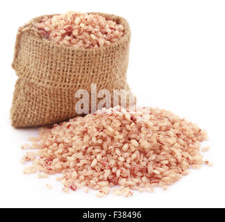 Fresh rice in sack bag over white background Stock Photo