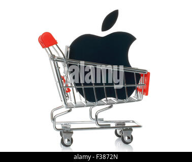 KIEV, UKRAINE - JANUARY 16, 2015: Apple logotype printed on paper and placed into shopping cart. Stock Photo
