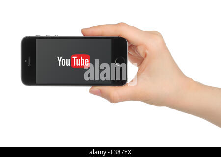KIEV, UKRAINE - MARCH 7, 2015:Hand holds iPhone 5s Space Gray with YouTube logo on white background. Stock Photo
