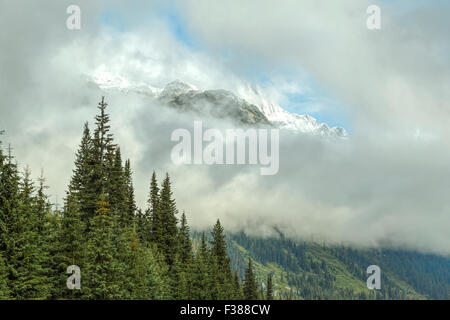 Fresh snow on mountain peaks in Glacier National Park, Trans Canada Highway, Columbia Shuswap, British Columbia, Canada. Stock Photo