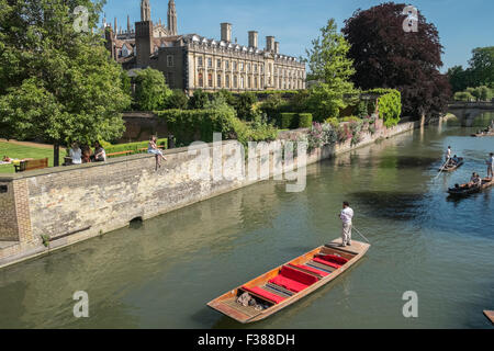 Punting on the River Cam, Cambridge, Cambridgeshire, with Clare College building and gardens in the background. Stock Photo