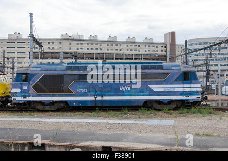 Blue old electrical train on a urban background Stock Photo