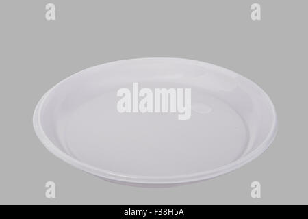 disposable plastic plate on a gray background Stock Photo