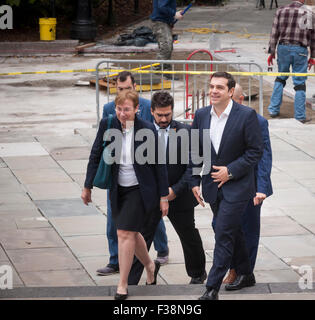 New York, USA. 1st October, 2015. Greek Prime Minister Alexis Tsipras, right, arrives with aides at New York City Hall for a meeting with New York Mayor Bill de Blasio on Thursday, October 1, 2015. The PM and the Mayor exchanged pleasantries during a brief photo op for the press. The International Monetary Fund has been criticized for promoting its punishing austerity programs related to Greece's massive debt and weak economy.   (© Richard B. Levine) Credit:  Richard Levine/Alamy Live News Stock Photo