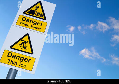 Sign showing danger of deep water and thin ice Stock Photo