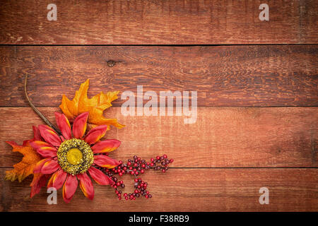 grunge red barn wood background with colorful fall decoration Stock Photo