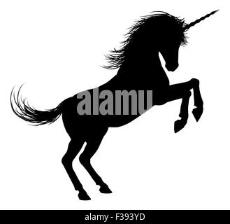 Unicorn mythical horse in silhouette standing on hind legs Stock Photo