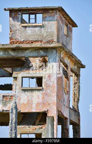 Old tower destroyed and abandoned as a hazardous wreck Stock Photo