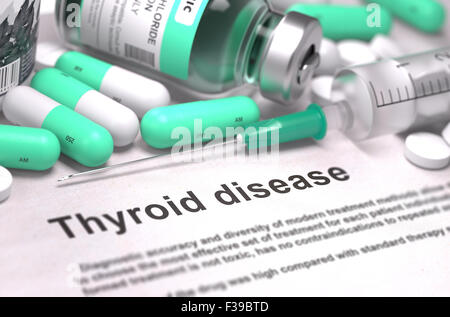 Diagnosis - Thyroid Disease. Medical Concept with Light Green Pills, Injections and Syringe. Selective Focus. Blurred Background Stock Photo