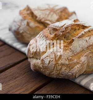 Extreme clos-up of rustic Italian bread, isolated on background out of focus. Stock Photo