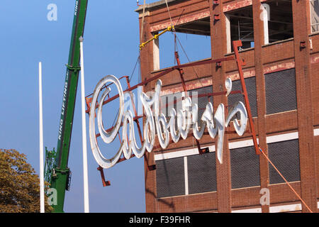 Keynsham, Somerset, UK. 2nd October, 2015. Built by the Fry family who merged with Cadbury's after the first world war, the Somerdale factory produced favorite confections such as Fry's Chocolate Cream, Crunchie and Cadbury's Cream Eggs. The iconic Cadbury's sign has overlooked the local area for many years.  The company was taken over by Kraft and  production moved to Poland. The site is now being developed by Taylor Wimpey for housing and Freeman Retirement Living are converting the main building for retirement housing. Credit:  Mr Standfast/Alamy Live News Stock Photo