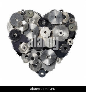 Isolated objects: heart shape made of metal pinions and sprockets, isolated on white background. Technical abstract for Valentin Stock Photo