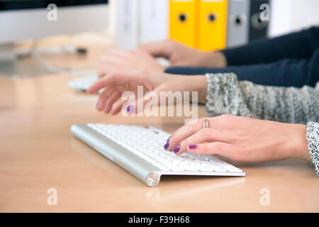 Female fingers typing on keyboard Stock Photo