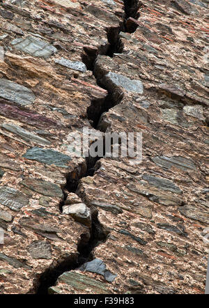 Cracked red brick wall of a medieval fortress Stock Photo