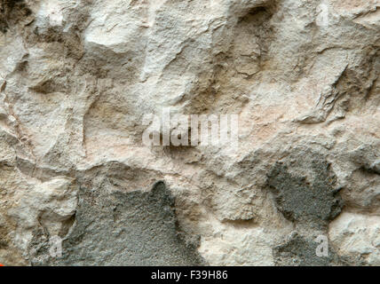 Old weathered stone wall for background or texture Stock Photo