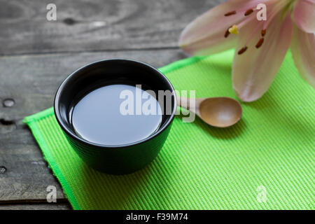 Asian tea cup and spa settings on wooden board, close up Stock Photo