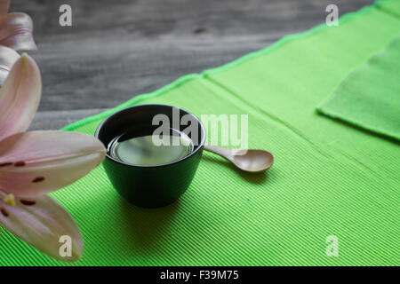 Asian tea cup and spa settings on wooden board, close up Stock Photo