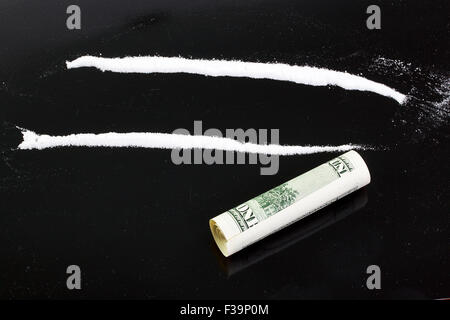 cocaine powder in lines on a black background Stock Photo