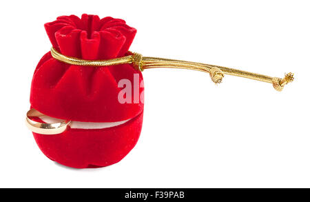 gold wedding ring in close red velvet box isolated on white background Stock Photo
