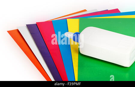Close up colorful paper with glue isolated on white bacground Stock Photo