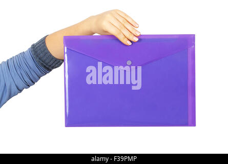 Female hand holding a purple plastic folder isolated on white background Stock Photo