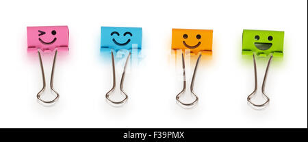 Colorful metal binders with smiles isolated on a white background Stock Photo