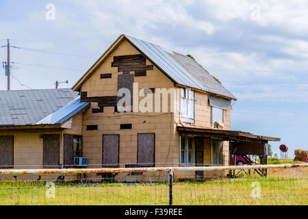 An old, dilapidated boarded-up farmhouse in the countryside around Guthrie, Oklahoma, USA. Stock Photo