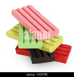 Children bright multicoloured plasticine in the column isolated on white background Stock Photo