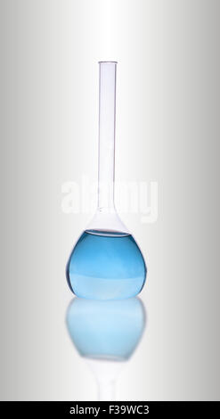 Laboratory blue glassware on gray background Stock Photo