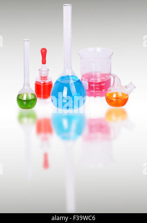 Laboratory glassware on gray background Stock Photo