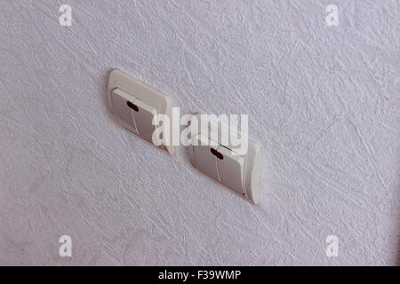 wall hanging two light switches Stock Photo