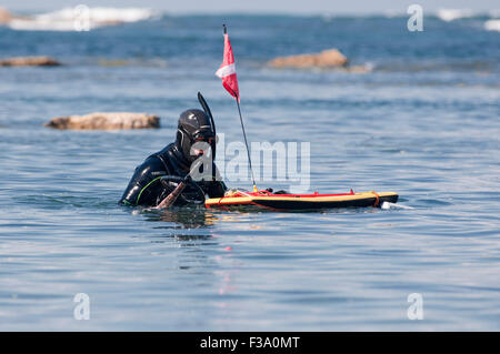 Spearfisherman diving on the sea with a marker buoy. Erromardie beach ...