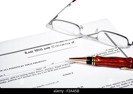 Last will and testament with reading glasses and a wooden pen isolated on white Stock Photo