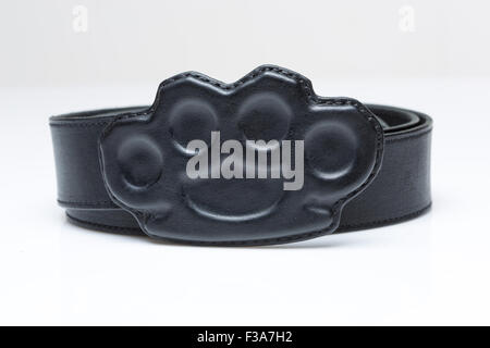 black belt with a buckle in the form of brass knuckles Stock Photo - Alamy