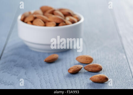 roasted almonds in white bowl Stock Photo